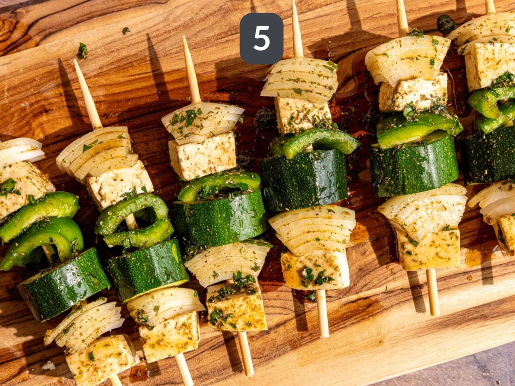 Vegan Grilled Chicken Skewers step 5 - brush the skewers with the marinade.