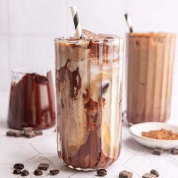A vegan iced mocha, swirled with chocolate syrup.