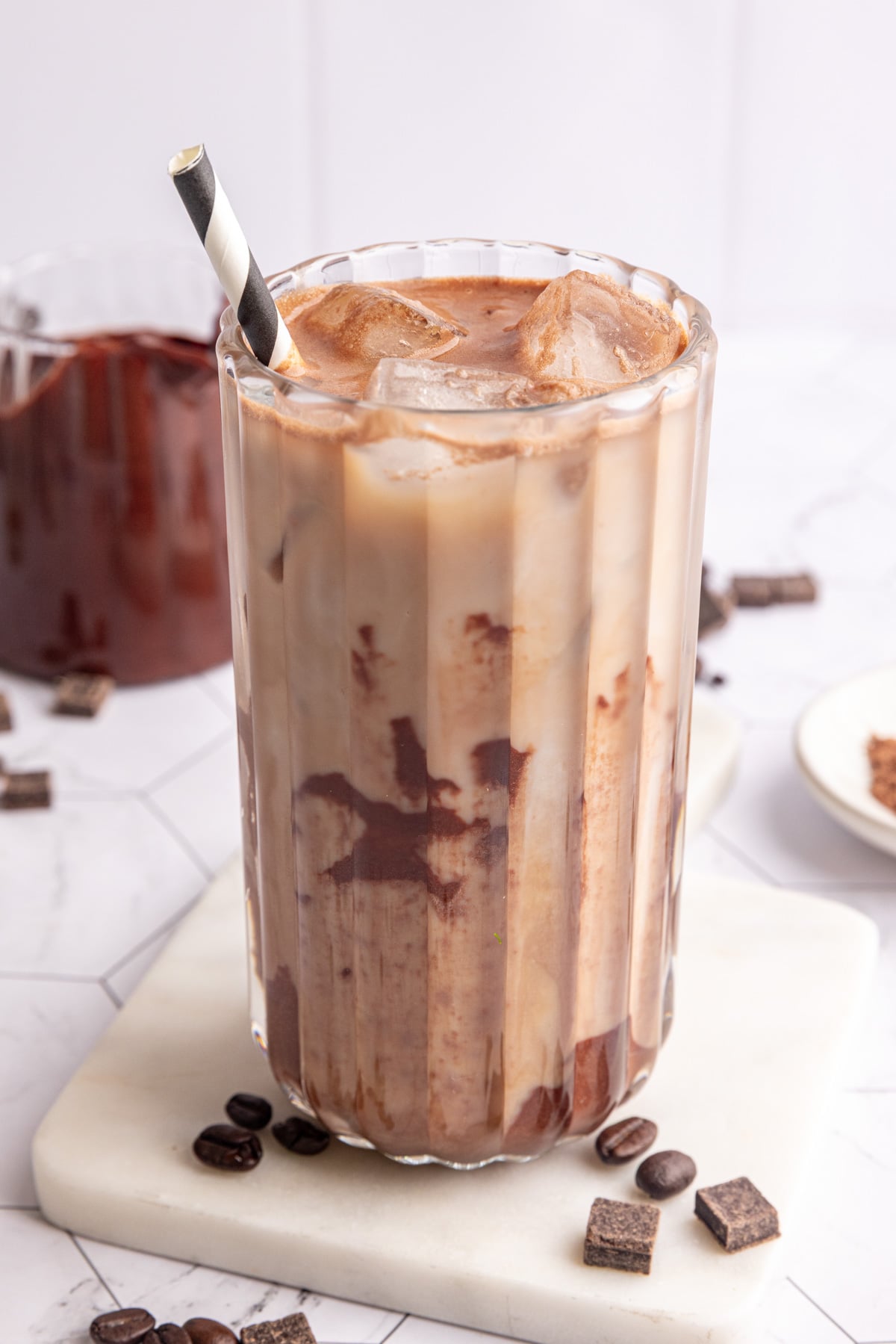 A vegan iced mocha, swirled with chocolate syrup.