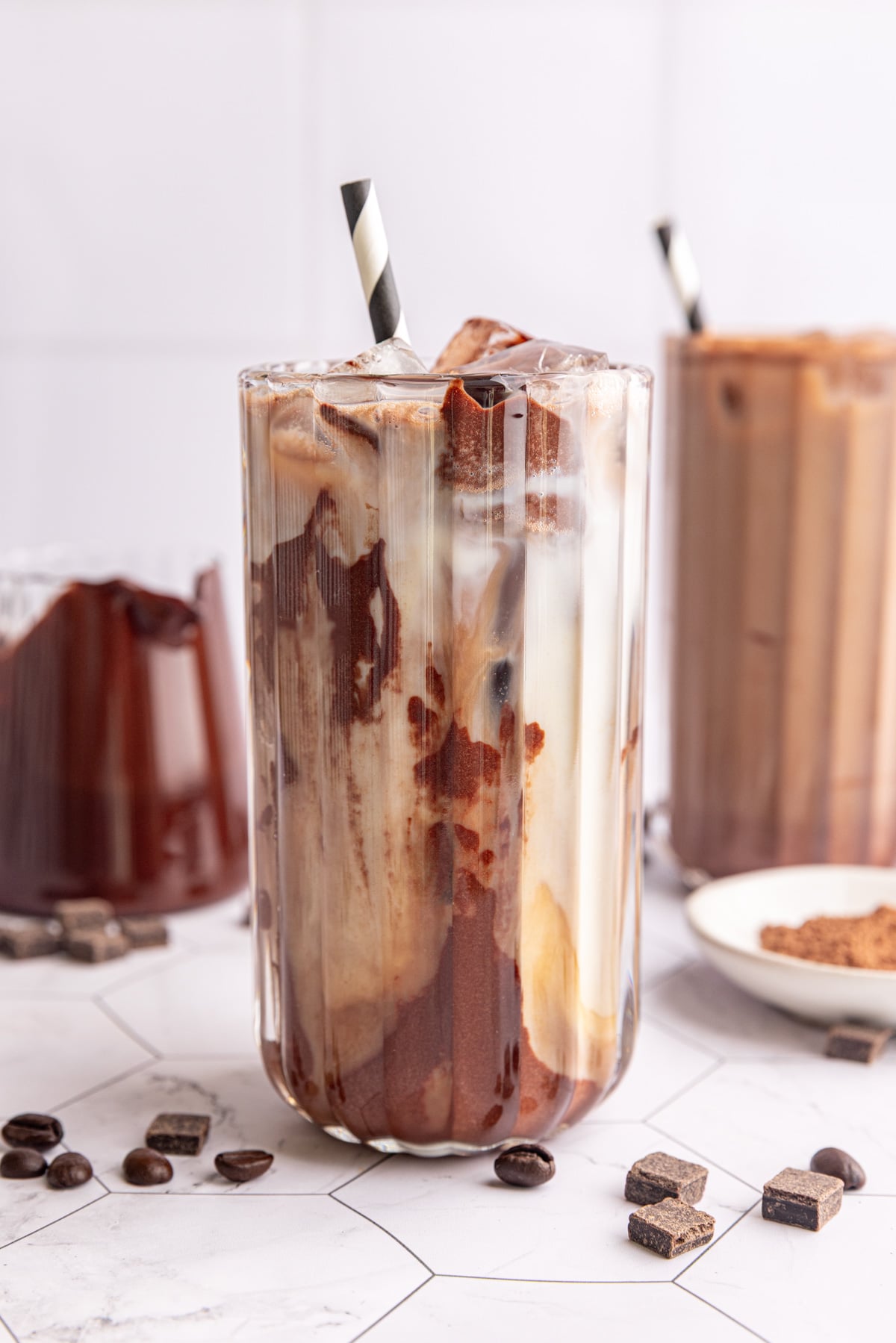 A vegan iced mocha, swirled with chocolate syrup.