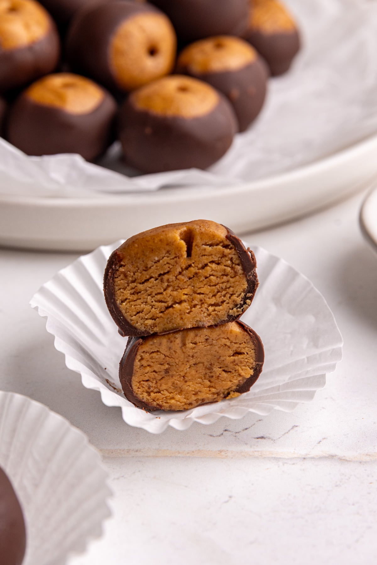 A vegan buckeye, sliced in half to reveal the texture.
