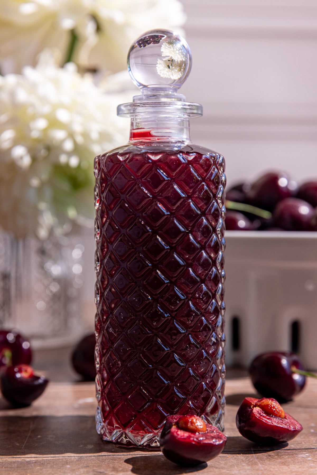 A bottle of cherry shrub.