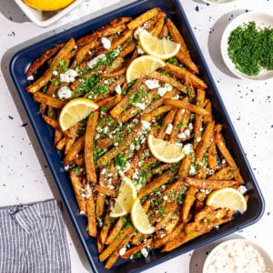 A tray of loaded greek feta fries.