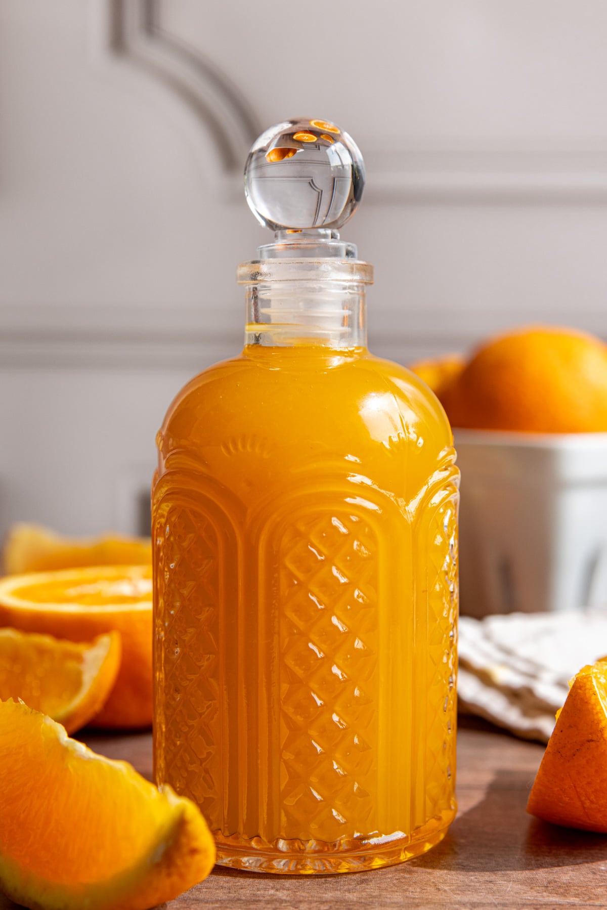 A bottle of orange syrup.