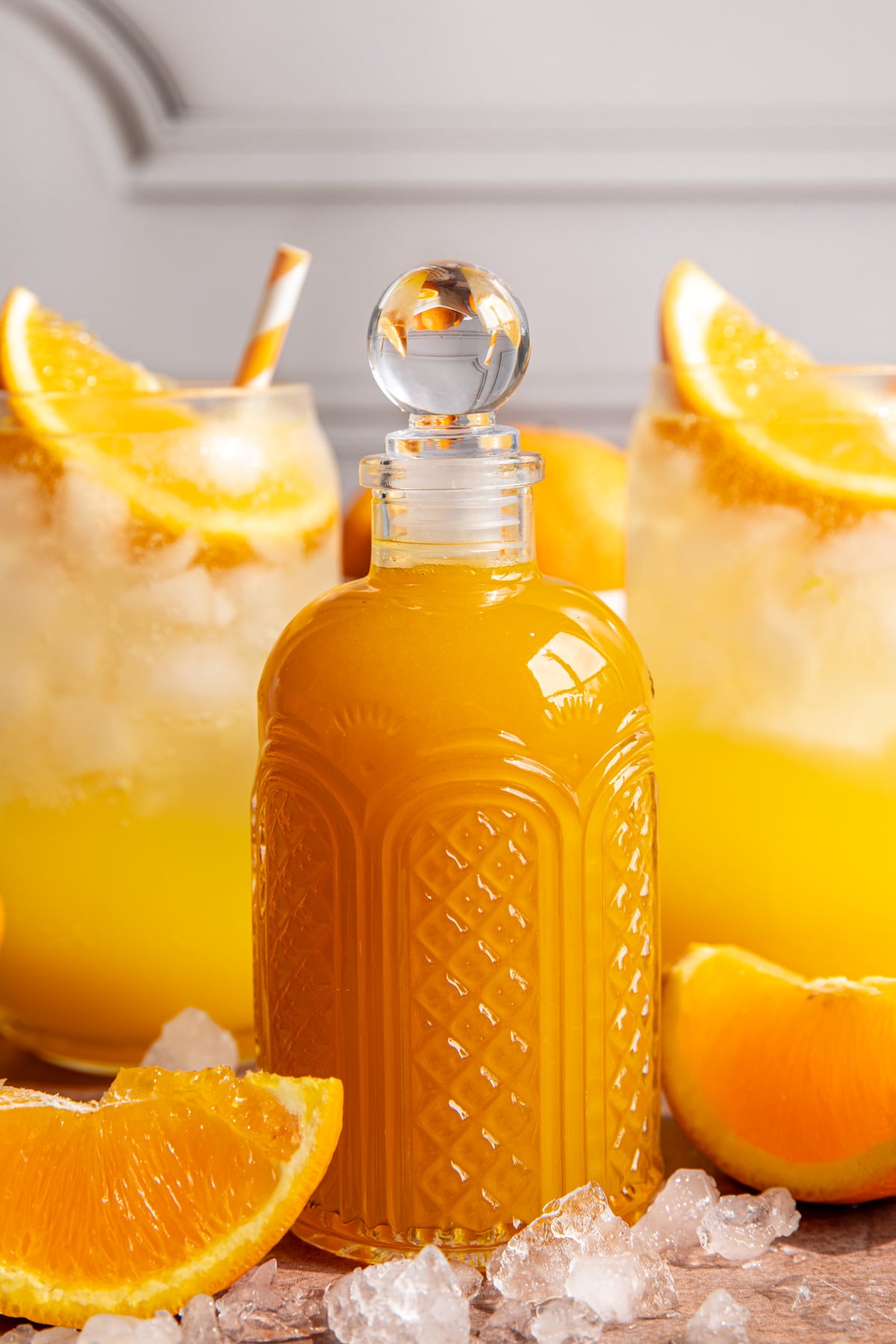 A bottle of orange syrup.