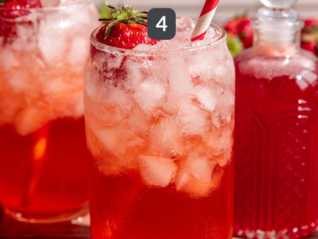 Strawberry Cream Soda Step 4 - serve over ice, topped with sparkling water.