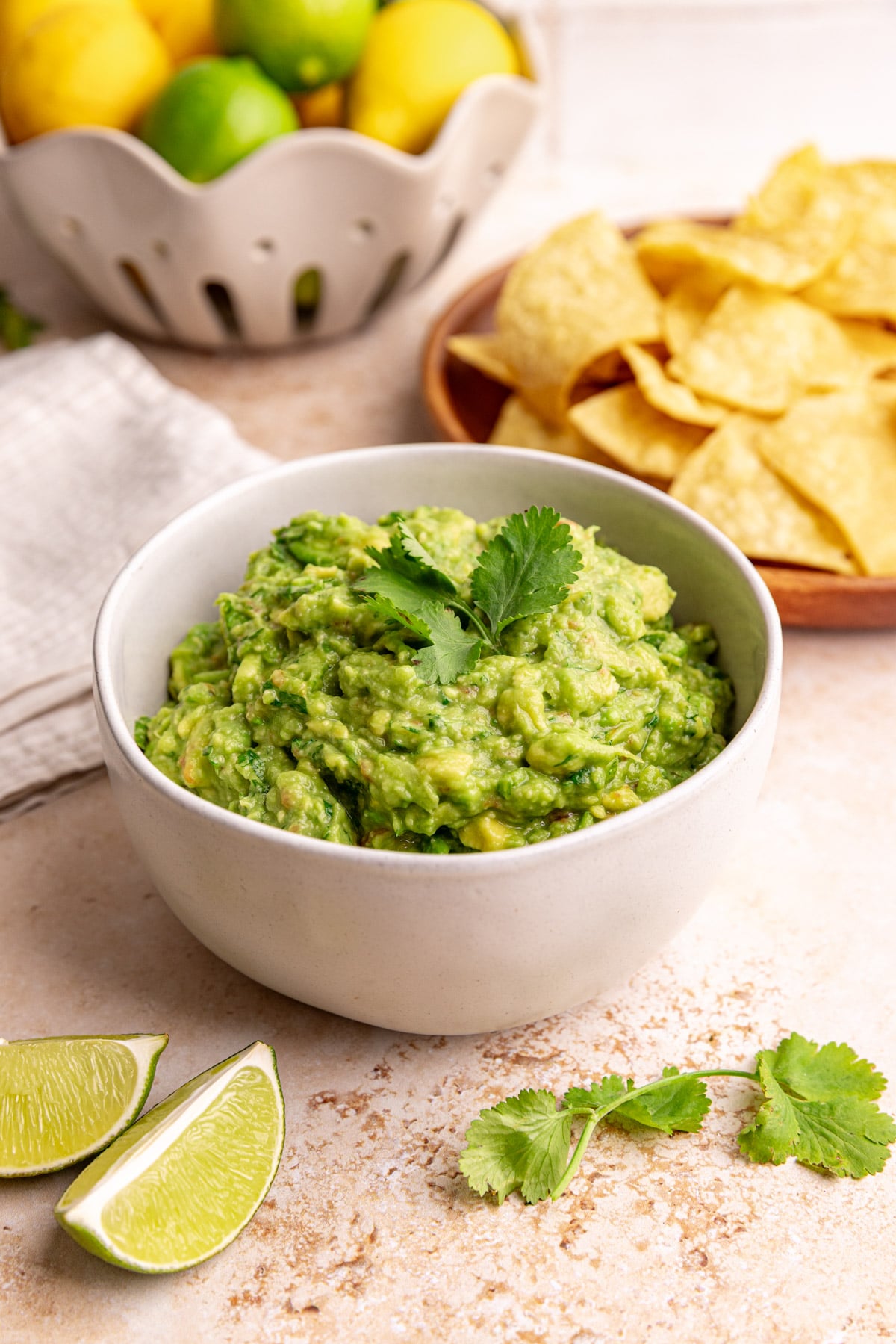 A bowl of the best ever guacamole, topped with cilantro.