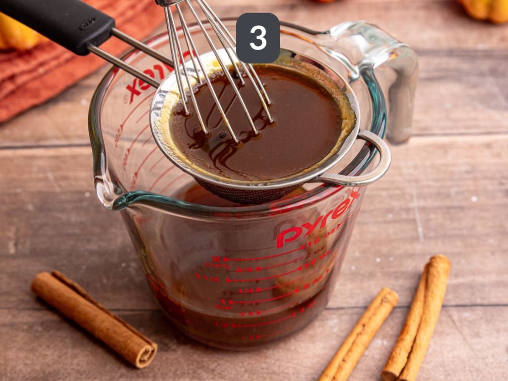Starbucks-Style Pumpkin Spice Syrup step 3 - strain the syrup.