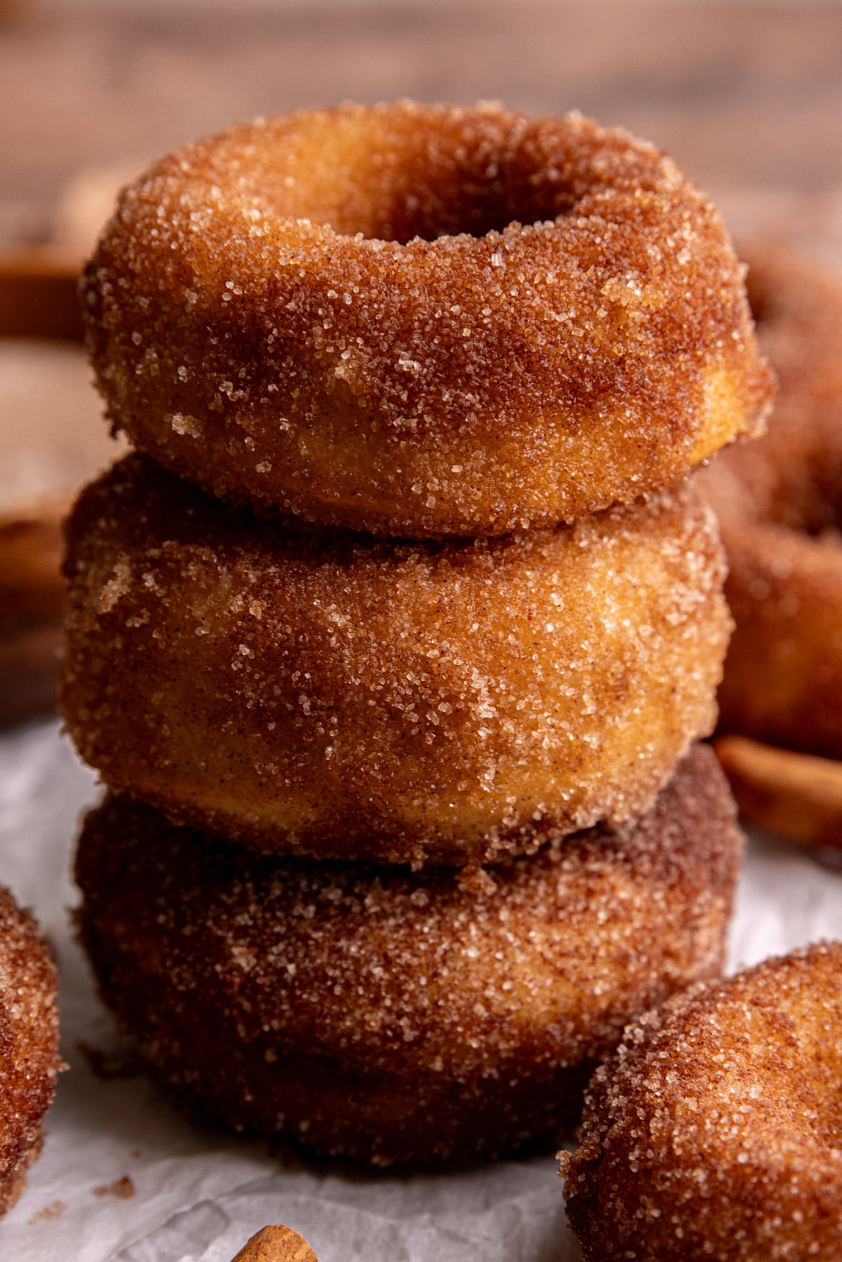 A stack of three vegan cake donuts.
