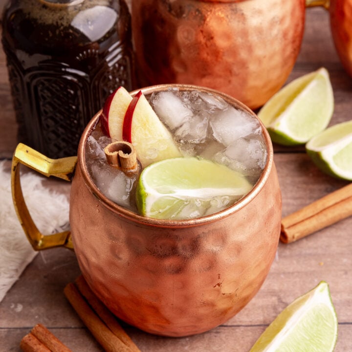 Several mugs of a Caramel Apple Mule Mocktail