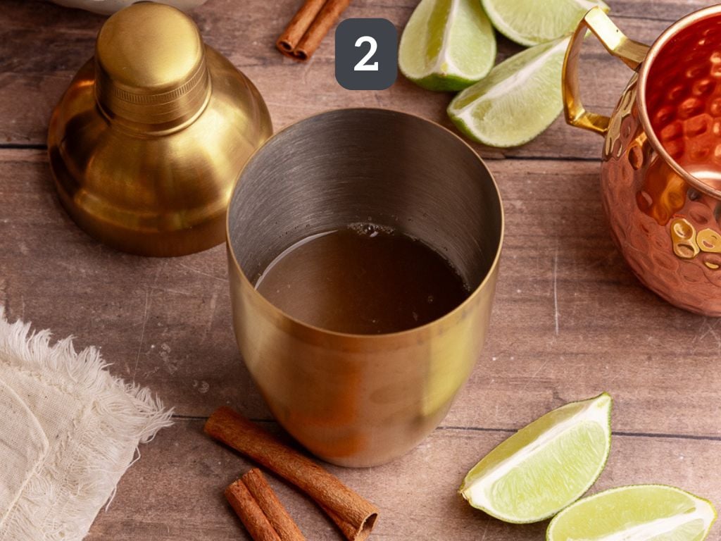 Caramel Apple Mule Mocktail Step 2 - mix the lime juice, coconut sugar syrup, and apple cider