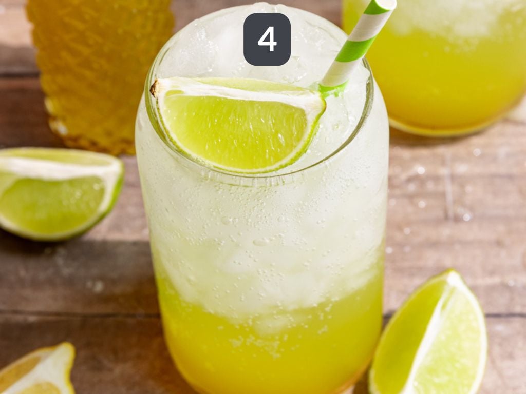 Homemade mountain dew step 4 - pour syrup over ice and top with sparkling water.