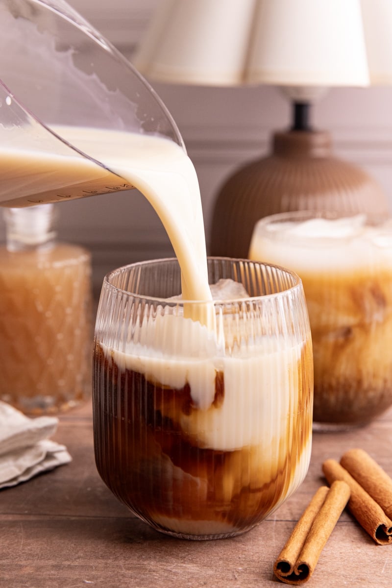 Milk being poured into a horchata shaken espresso