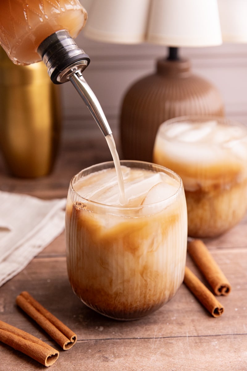 Extra horchata syrup being poured into a horchata shaken espresso