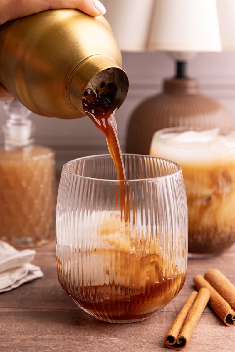 Shaken espresso being poured into a glass.