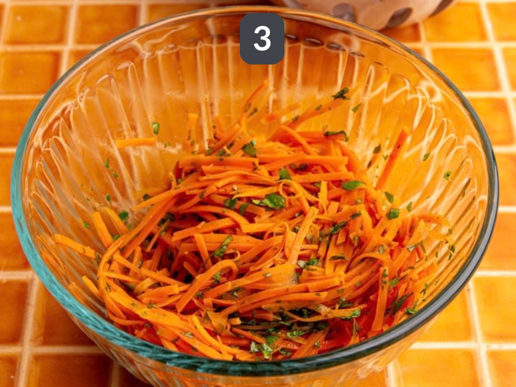 Bibibop style sesame carrots step 3 - mix with the sesame oil and cilantro