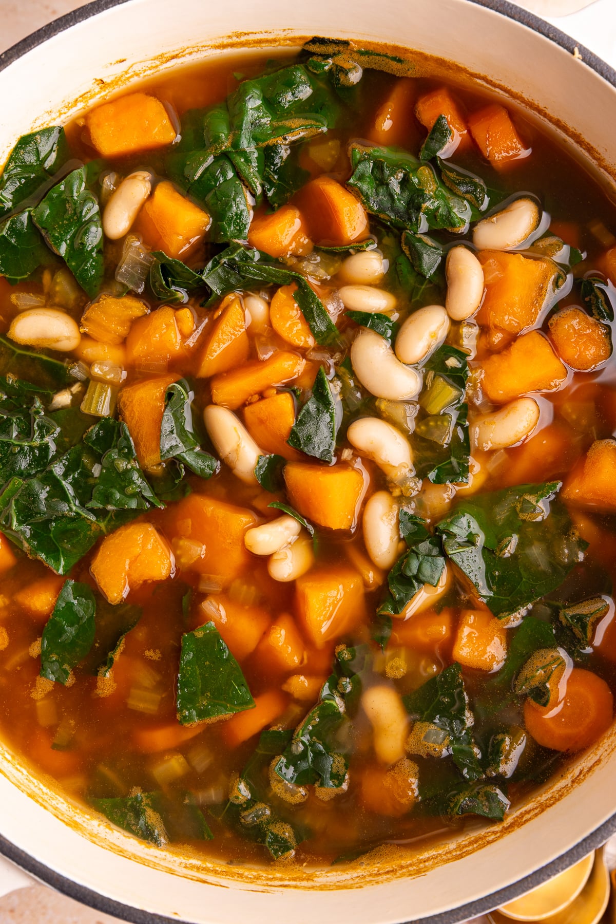 A pot of freshly cooked vegan harvest vegetable soup.