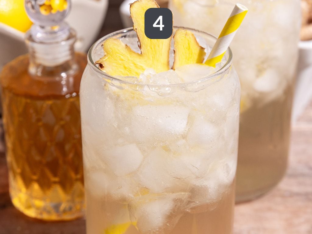 Homemade ginger ale step 4 - serve syrup over ice topped with sparkling water.