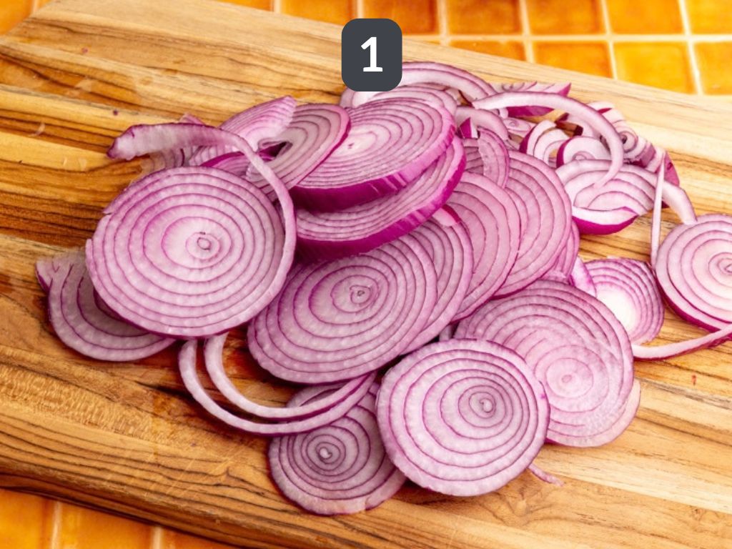 Homemade pickled red onions step 1 - slice the onions.