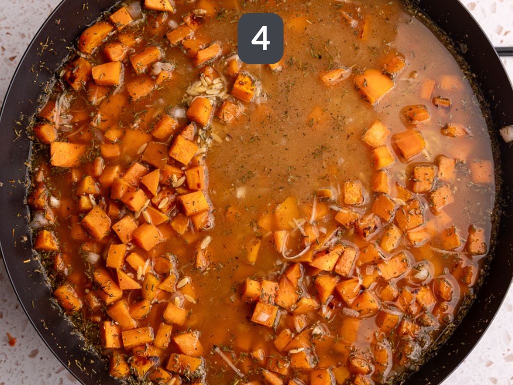 Vegan sweet potato baked orzo step 4 - add the broth, orzo, and spices.