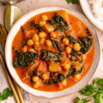 A bowl of tomato curry.