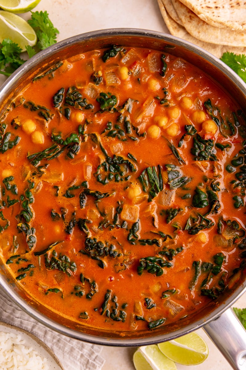 A skillet of freshly cooked vegan tomato curry.