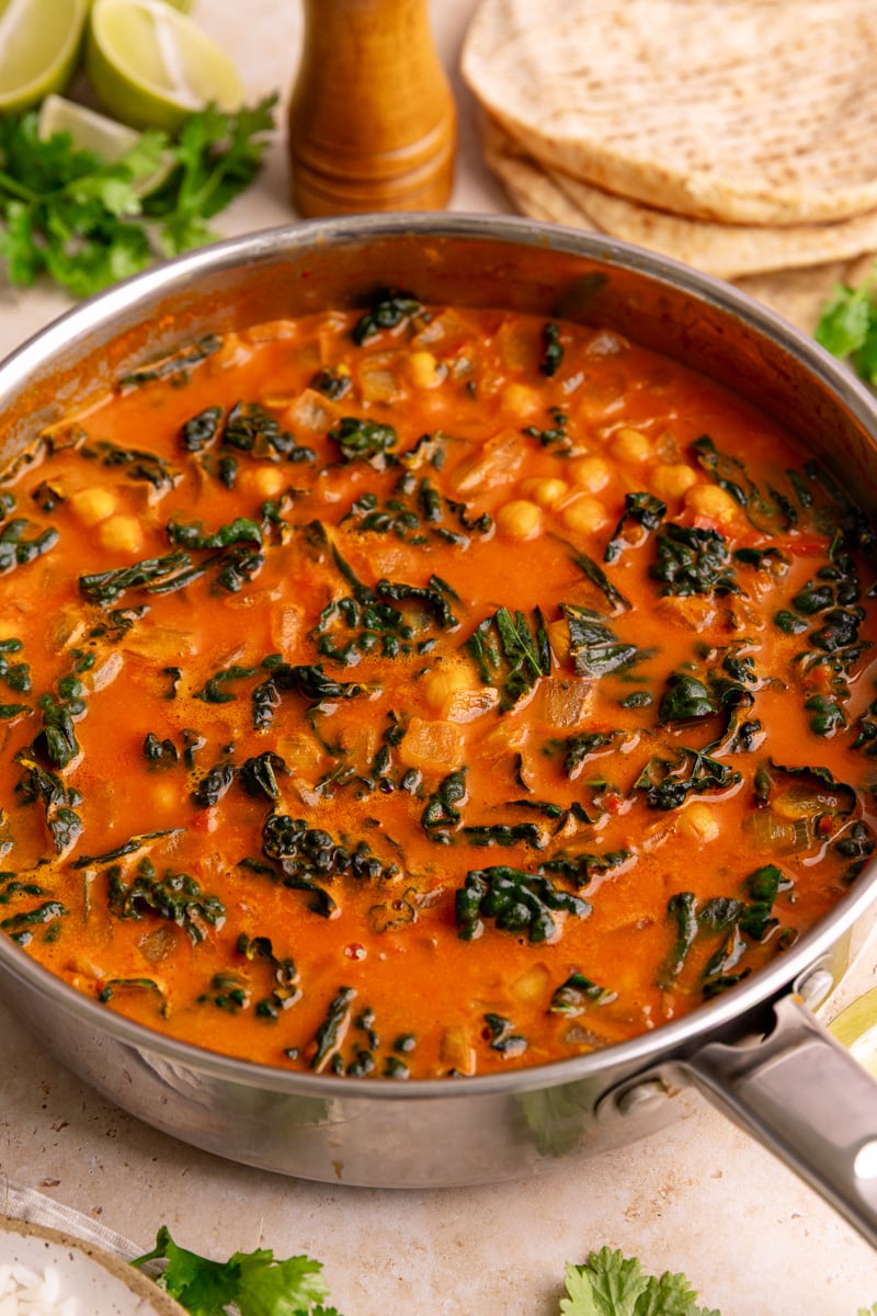 A skillet of freshly cooked vegan tomato curry.